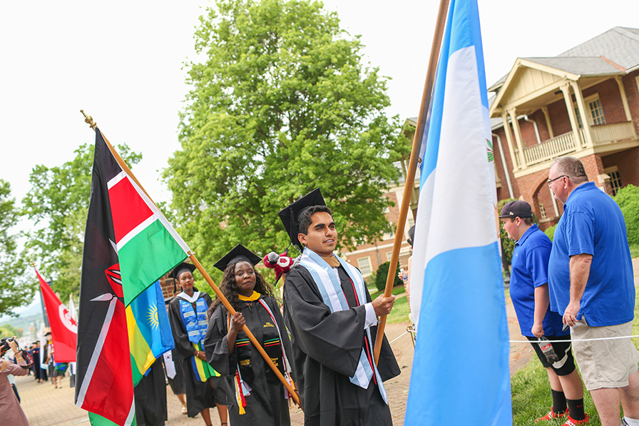 Student carrying flags