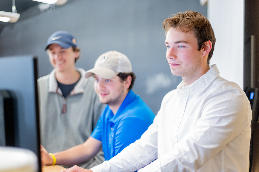 students looking at computer screen