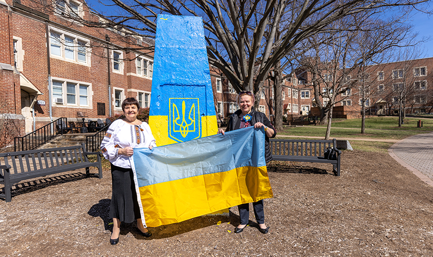Dr. Munsey holding Ukrainian flag 