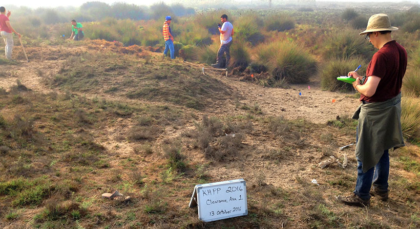 Researchers working at a dig site