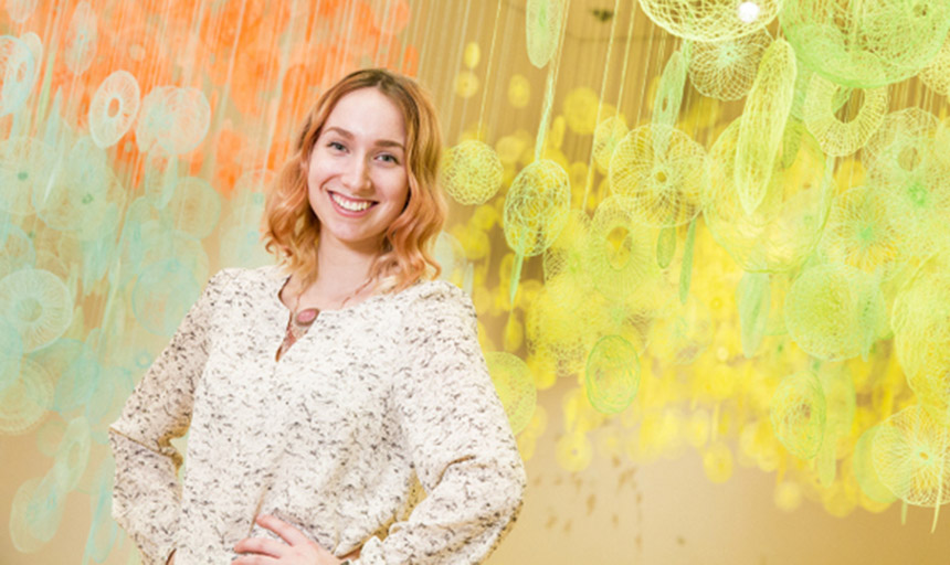 student pictured with colorful background