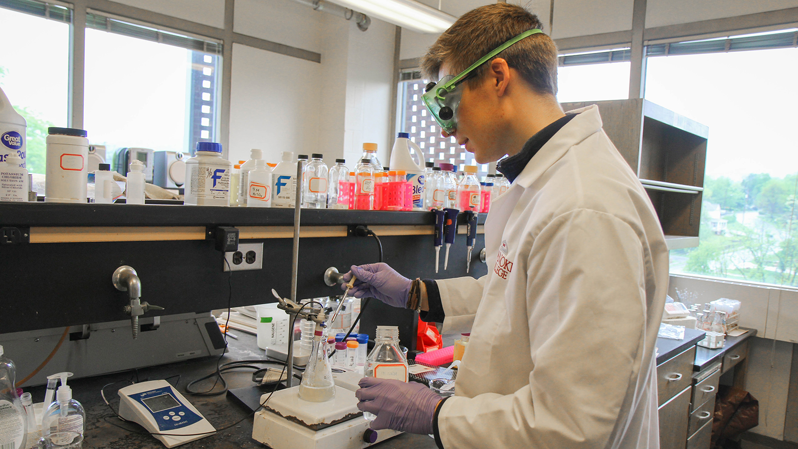 student using lab equipment