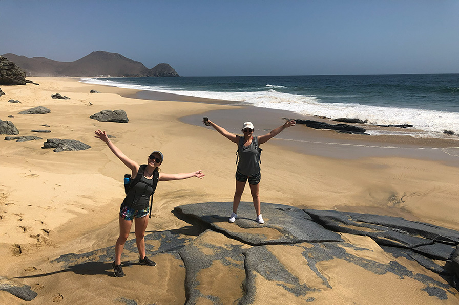 Two figures on a beach 