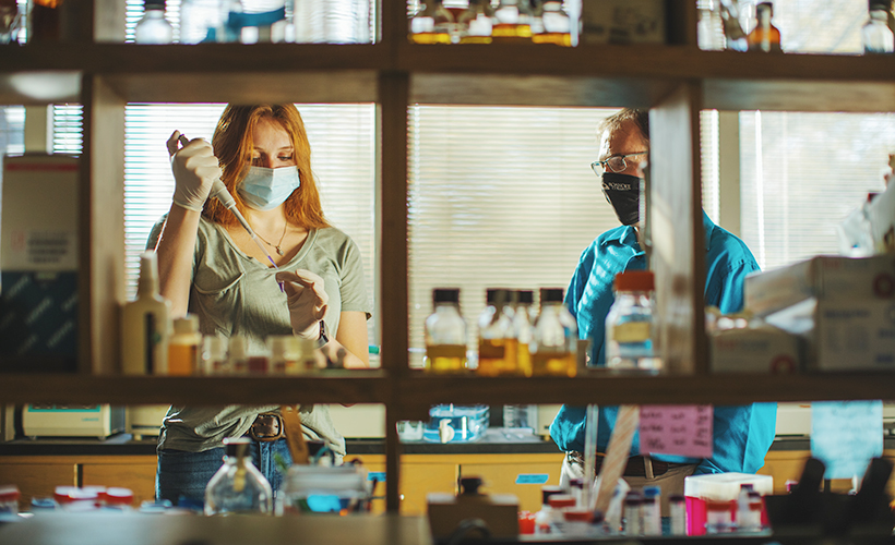 student and professor doing research