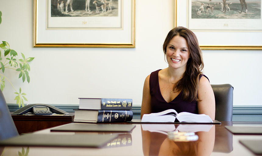 Woman pictured sitting at desk