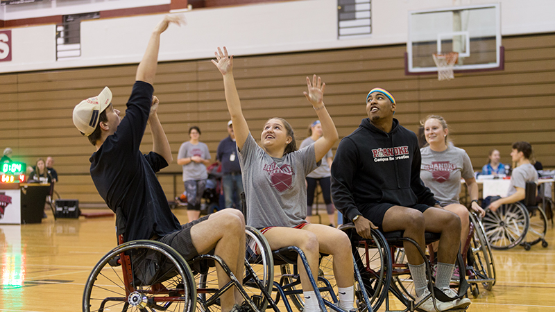 students play wheelchair basketball