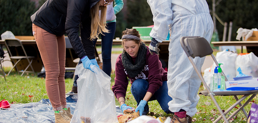 students going through trash