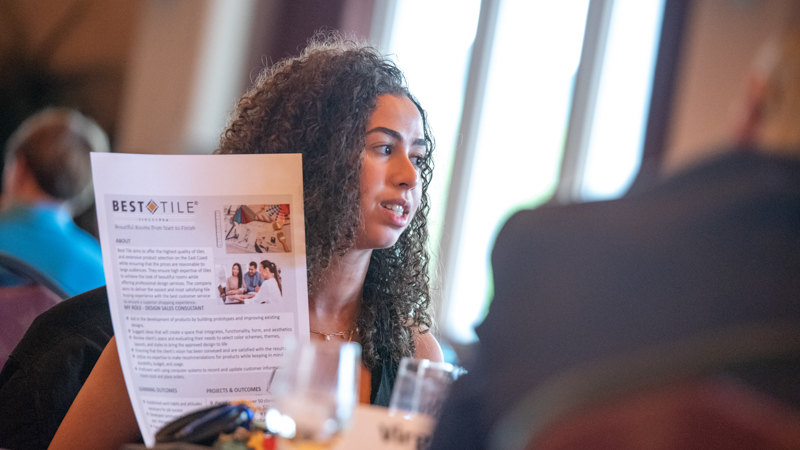 A student presenting a program for Best Tile