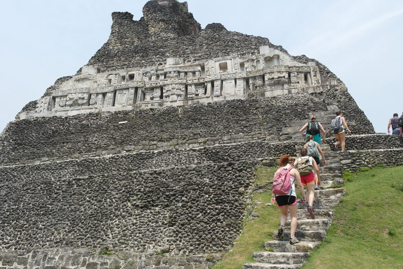 Students climbing up steps to ruins in a Latin American country