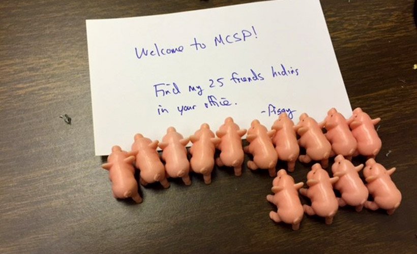 Note that reads: "Welcome to MCSP! Find my 25 friends hiding in your office. - Pigsy"
