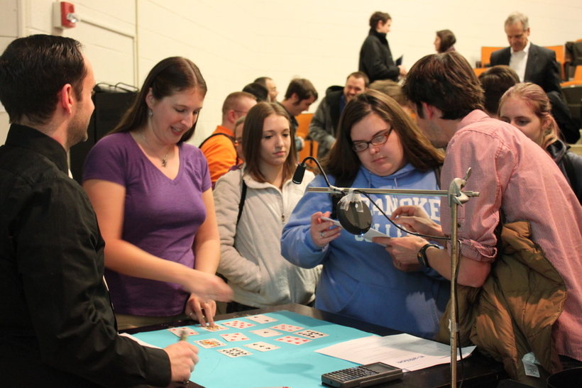 Students trying their own magic tricks