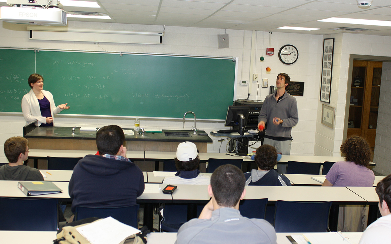 A professor juggles for a class exercise