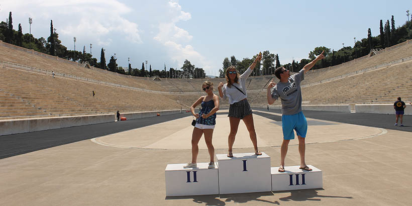 Students in the middle of an Olympic arena in Greece