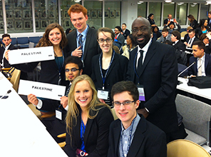 Model UN students smile for a photo at an event