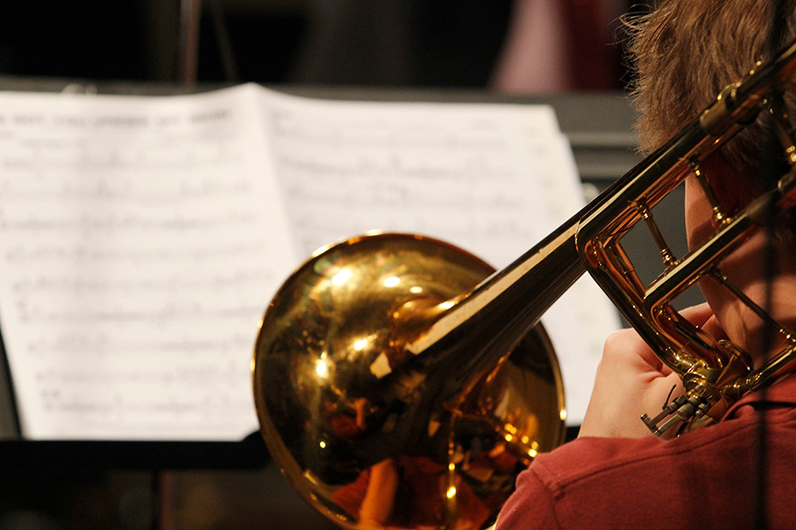 Figure playing trumpet