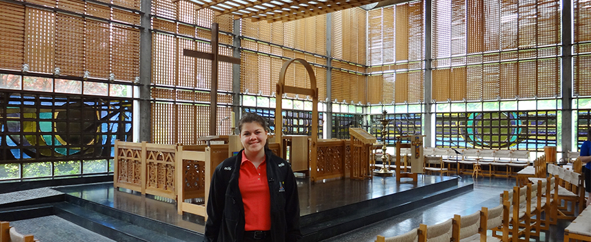 Bridget Gautieri stands in a brightly lit church space