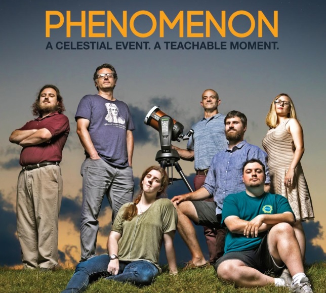 Magazine cover photo of students and faculty with telescope against a backdrop of an expansive sky