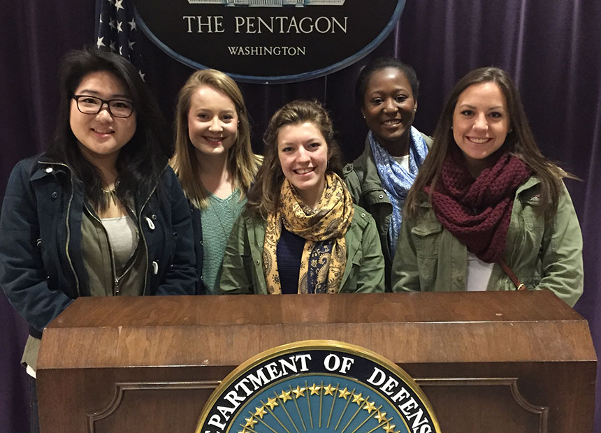Students behind the podium for the United States Department of Defense