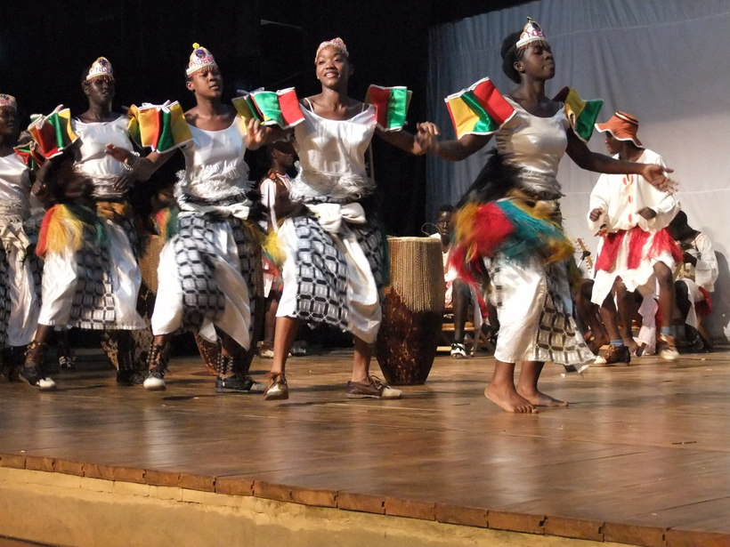 Ugandan community members participating in a traditional dance