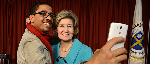 Student taking a selfie with a senator