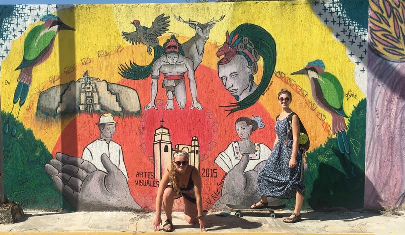 Students in front of a mural