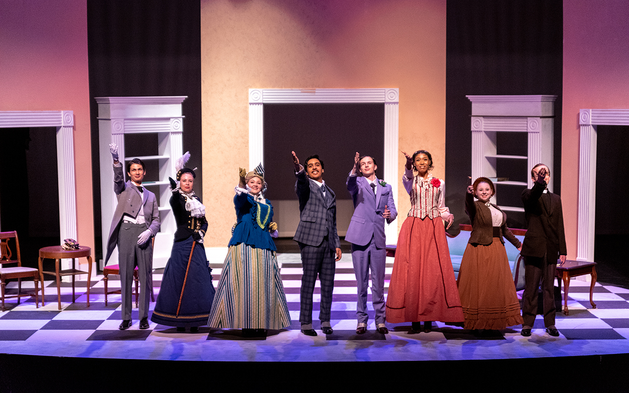 Cast of "The Importance of Being Earnest" lines up on stage for the final curtain call.