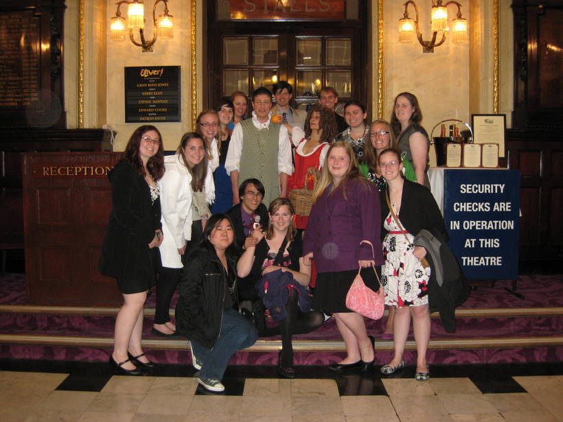 Students with actors at a theater