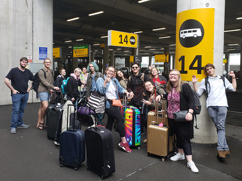 Students posing at a train station