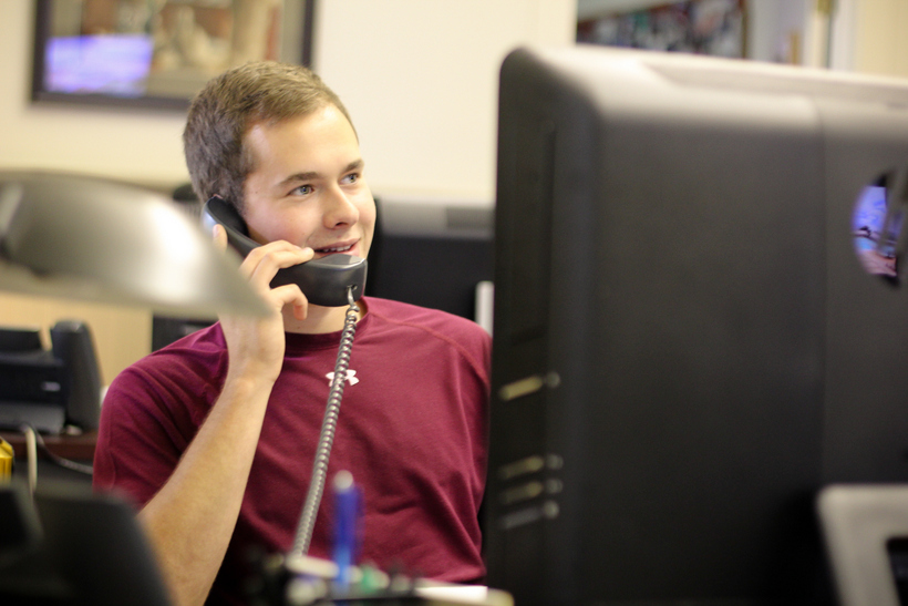 Student on the phone at a desk