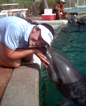 Heather Duvall getting kissed by a dolphin