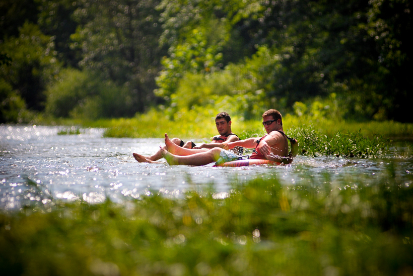 Students tubing in a river