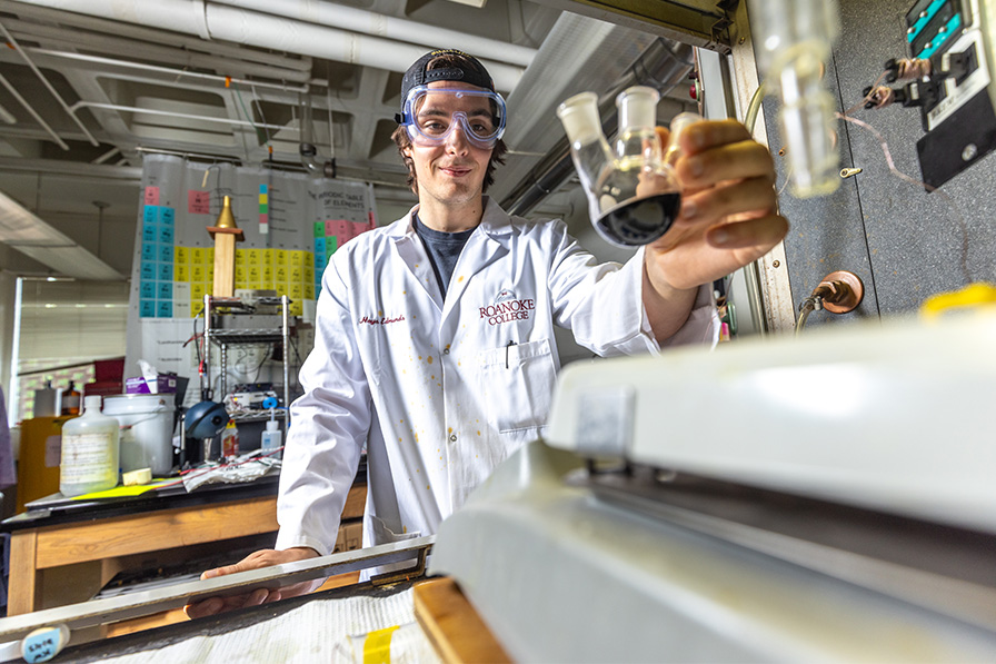 Chemistry student holding a beaker