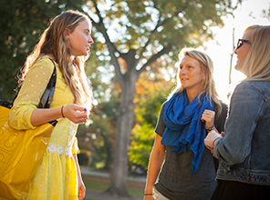 Students talking together and smiling