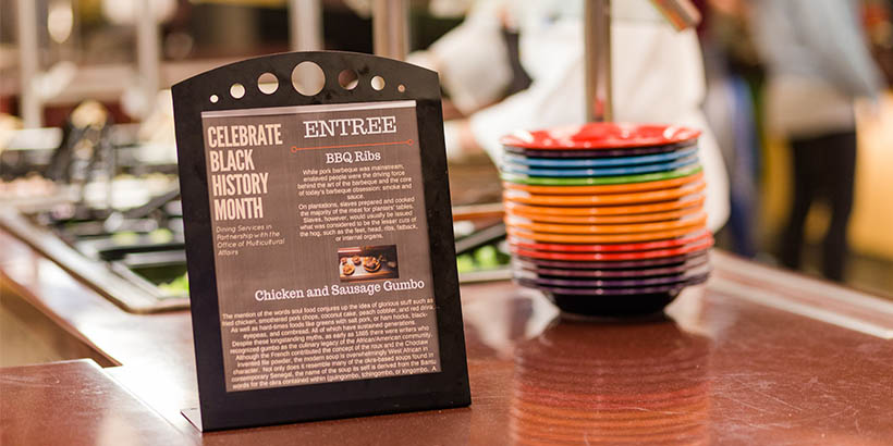 Menu to celebrate black history month next to colorful bowls