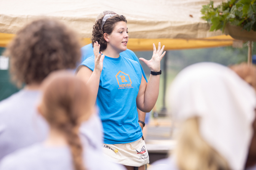 student talking to a group