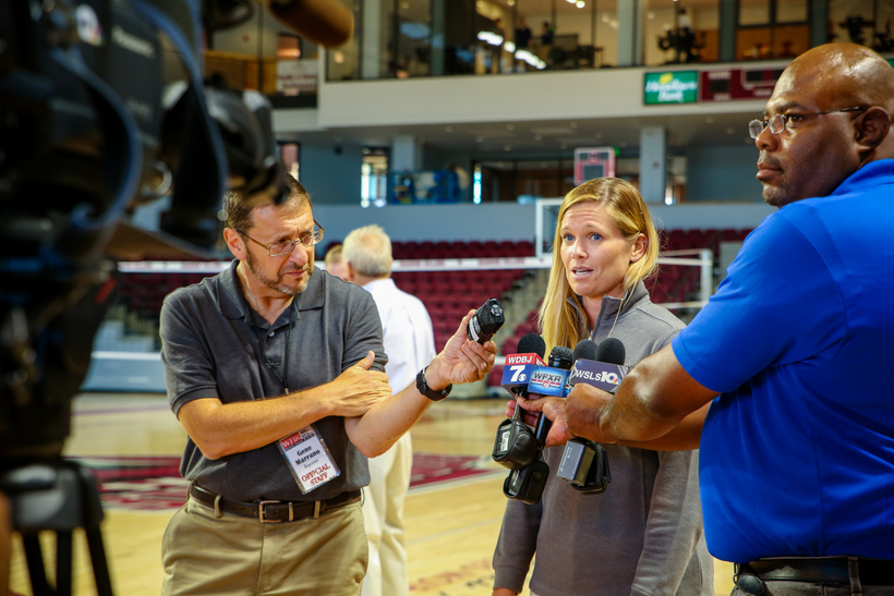 A student athlete being interviewed by local news