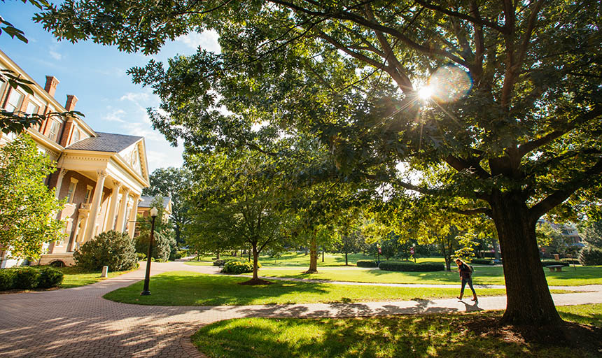 student walking on the back quad