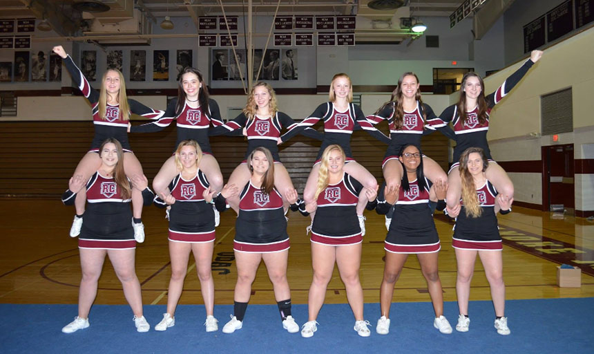 Cheerleaders doing shoulder sits