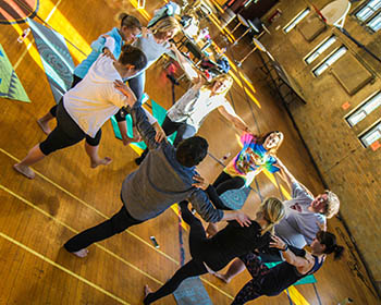 People in a circle doing yoga