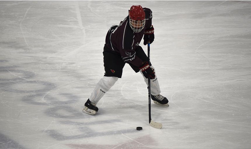 A student playing hockey