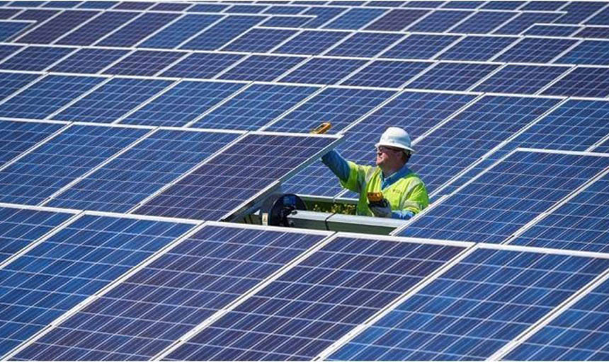 a person working on solar panels