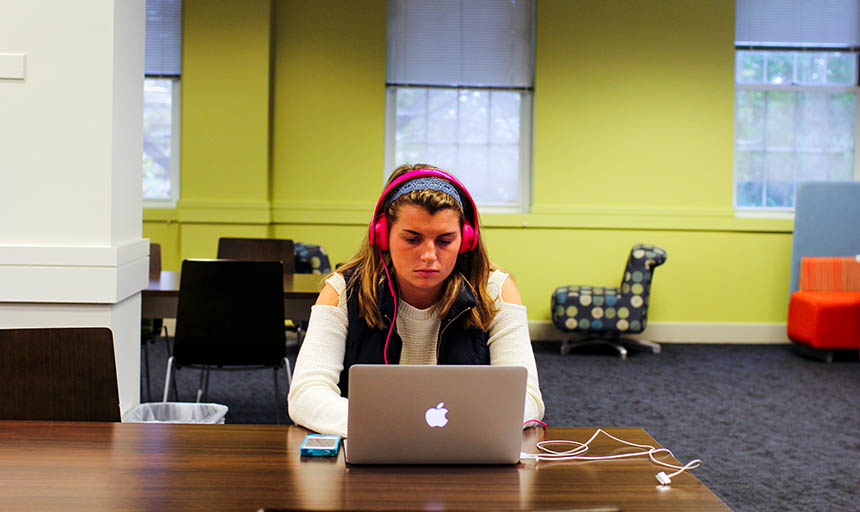 A student working on her laptop