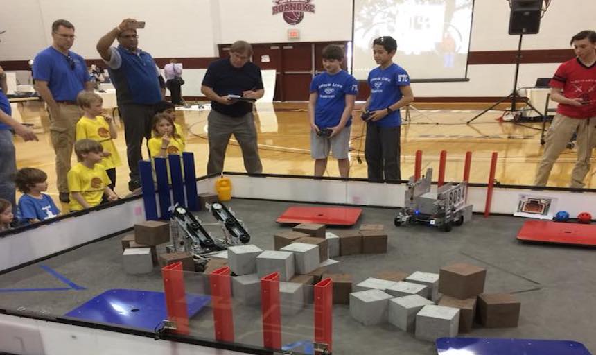 students working on robots