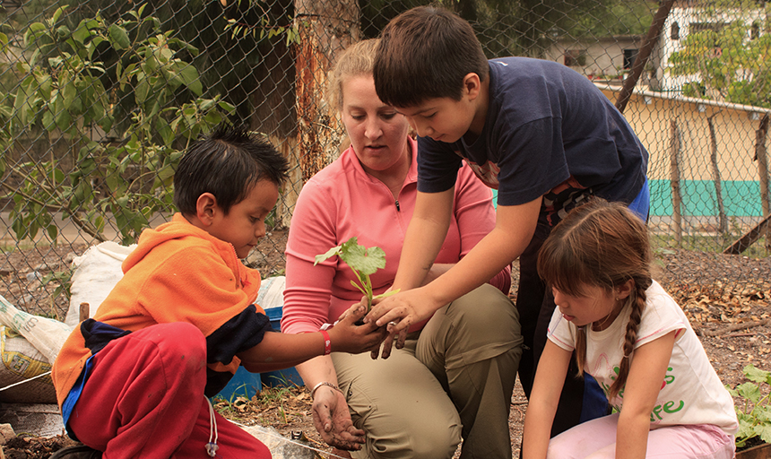 A person in the Peace Corps working with children