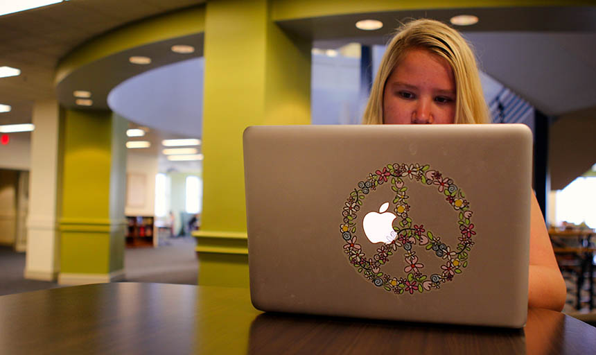 A student working on her laptop