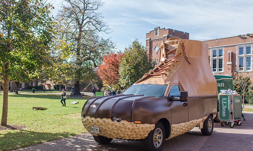 truck modified to look like a giant LL Bean boot sits on the back quad