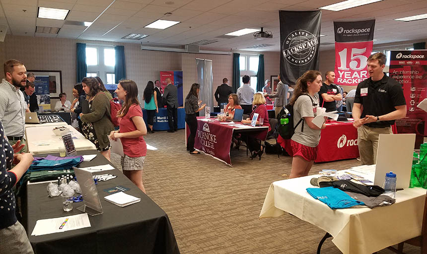 Students interacting with employers at an in-person career event before the COVID-19 pandemic