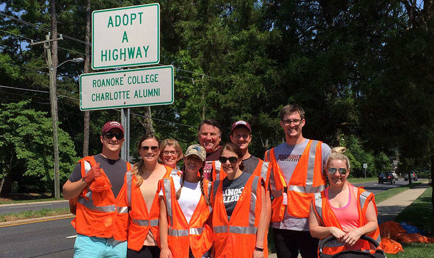 Alumni working together to clean a section of highway