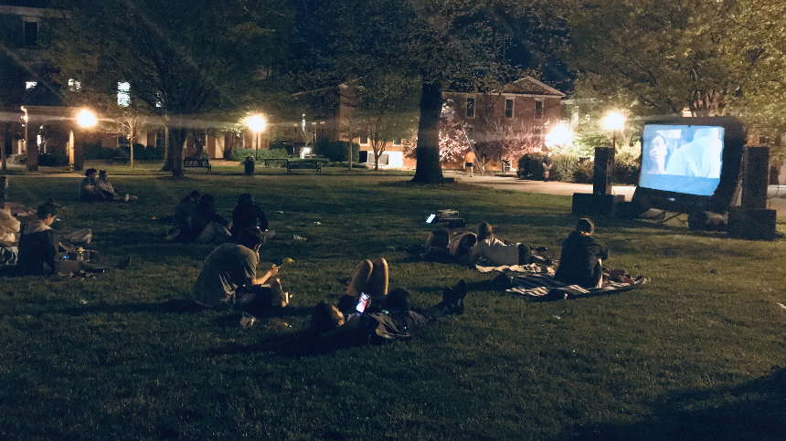 Students Watching a movie outside