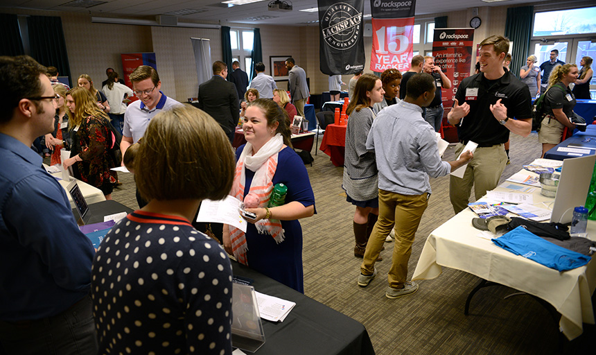 Students talking with employers at a past career fair